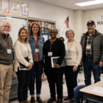 CAJA volunteers and staff at a school event
