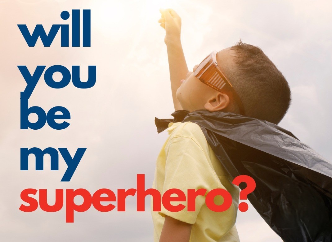 Child raising a fist, with text asking "Will you be my superhero?"